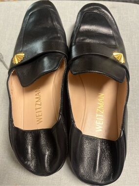 Stuart Weitzman Black Leather Loafers with Gold Shell Accent